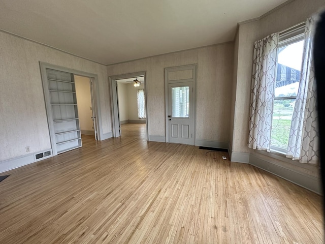 503 N William St, Farmer City, IL 61842 - entryway featuring visible vents, baseboards, ceiling fan, and wood finished floors