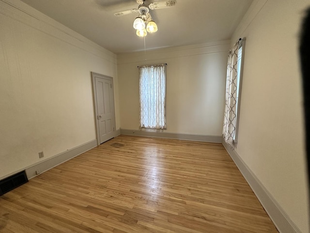 503 N William St, Farmer City, IL 61842 - empty room with baseboards, ceiling fan, and light wood-style flooring
