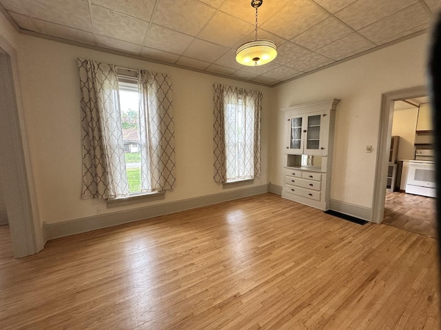 503 N William St, Farmer City, IL 61842 - spare room with baseboards and light wood-type flooring