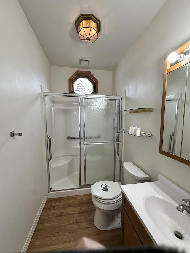 503 N William St, Farmer City, IL 61842 - full bath featuring toilet, a shower stall, wood finished floors, and vanity