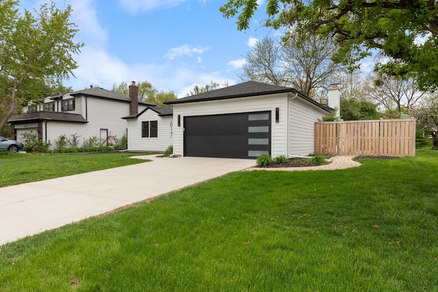 617 Sara Ln, Naperville, IL 60565 - view of front of house featuring fence, a garage, a front yard, a chimney, and concrete driveway