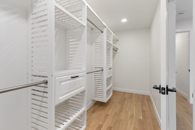 617 Sara Ln, Naperville, IL 60565 - spacious closet with light wood-style flooring