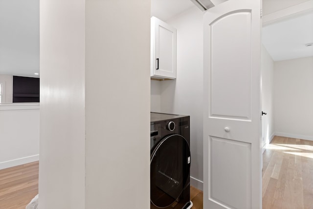 617 Sara Ln, Naperville, IL 60565 - washroom featuring light wood-style floors, baseboards, cabinet space, and washer / clothes dryer
