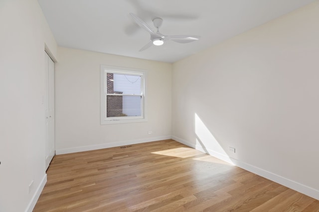 617 Sara Ln, Naperville, IL 60565 - empty room with baseboards, ceiling fan, and light wood-style flooring