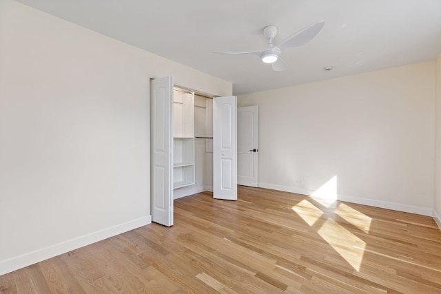 617 Sara Ln, Naperville, IL 60565 - unfurnished bedroom featuring a closet, baseboards, a ceiling fan, and light wood-style flooring