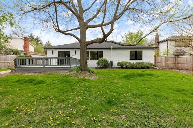 617 Sara Ln, Naperville, IL 60565 - back of house featuring a lawn, a shingled roof, fence, and a deck