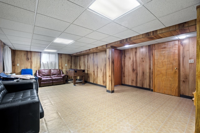 6338 Parkwood Ct, Oak Forest, IL 60452 - living area with wooden walls, light floors, a paneled ceiling, and baseboards