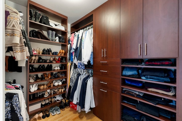 spacious closet with light wood finished floors