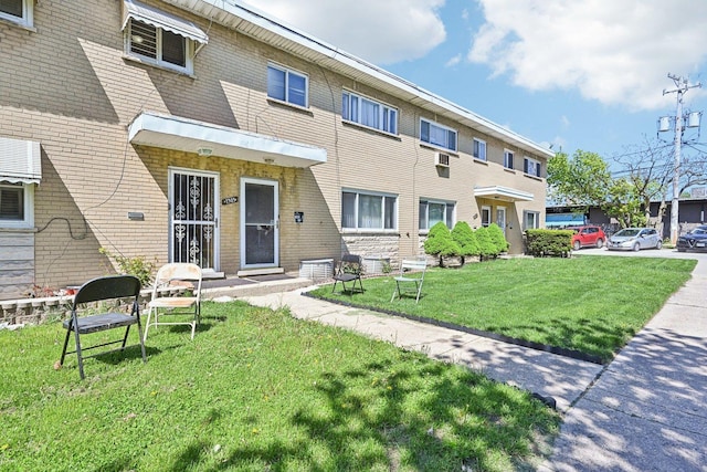7303 N Campbell Ave Unit A, Chicago, IL 60645 - view of front of property with a front lawn and brick siding