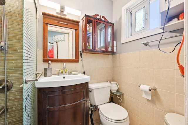 7303 N Campbell Ave Unit A, Chicago, IL 60645 - full bath with toilet, tile walls, vanity, and a shower stall