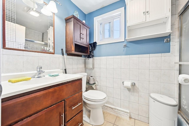 7303 N Campbell Ave Unit A, Chicago, IL 60645 - bathroom with tile walls, toilet, tile patterned floors, an enclosed shower, and vanity