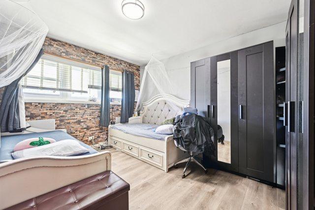 7303 N Campbell Ave Unit A, Chicago, IL 60645 - bedroom featuring light wood-style flooring