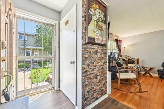 7303 N Campbell Ave Unit A, Chicago, IL 60645 - doorway with wood finished floors and baseboards