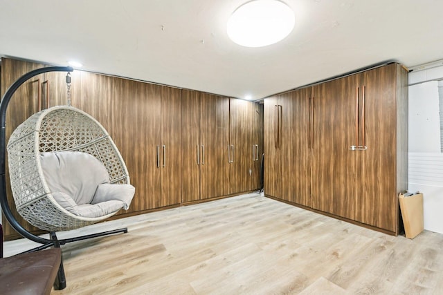 7303 N Campbell Ave Unit A, Chicago, IL 60645 - sitting room featuring light wood finished floors and wooden walls