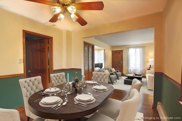 6511 174th St, Tinley Park, IL 60477 - dining room featuring a ceiling fan, a baseboard heating unit, wood finished floors, and baseboards