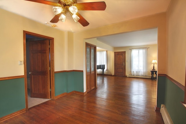 6511 174th St, Tinley Park, IL 60477 - unfurnished room with a baseboard heating unit, a ceiling fan, wood finished floors, and baseboards