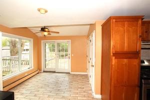 6511 174th St, Tinley Park, IL 60477 - unfurnished sunroom with a baseboard heating unit