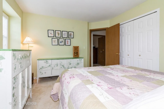 carpeted bedroom featuring a closet