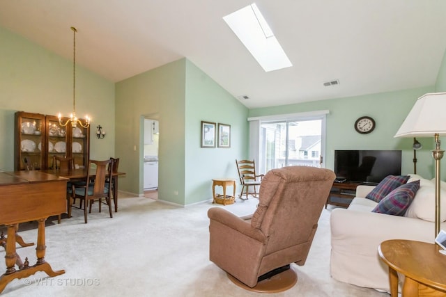 living area featuring a chandelier, high vaulted ceiling, light colored carpet, a skylight, and baseboards