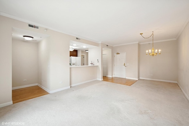 44 N Vail Ave Unit 313, Arlington Heights, IL 60005 - unfurnished living room with light carpet, crown molding, a chandelier, and baseboards