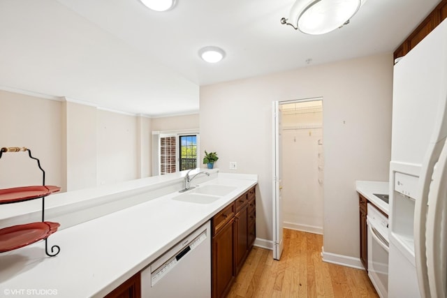 44 N Vail Ave Unit 313, Arlington Heights, IL 60005 - kitchen with white appliances, a sink, light wood finished floors, and light countertops