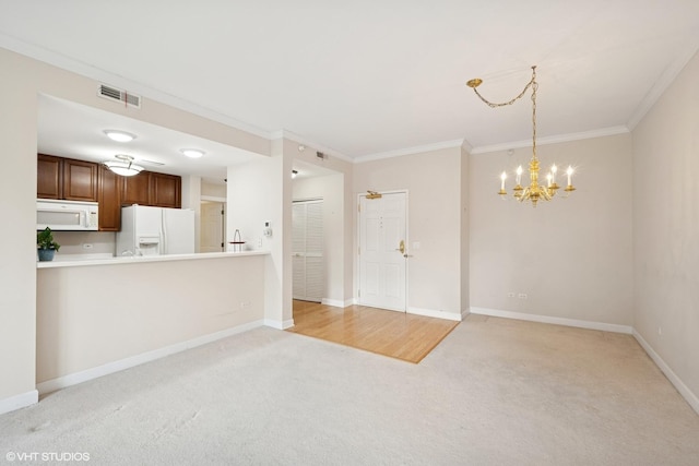 44 N Vail Ave Unit 313, Arlington Heights, IL 60005 - unfurnished living room with light carpet, ornamental molding, a chandelier, and baseboards