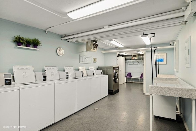 community laundry room with separate washer and dryer, water heater, and tile patterned floors