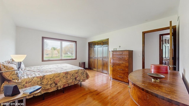 bedroom with a closet and light wood-style floors