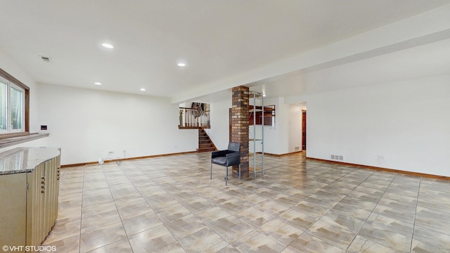 unfurnished living room featuring visible vents, recessed lighting, baseboards, and stairway