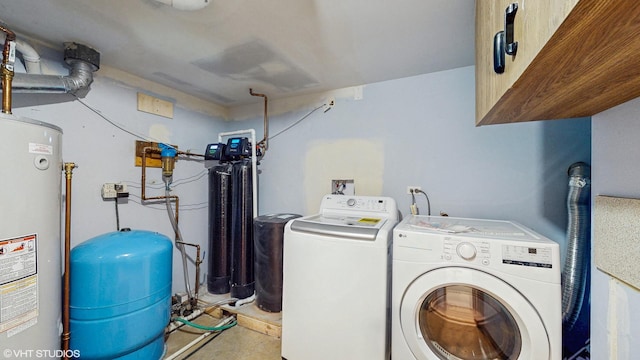 laundry area with cabinet space, gas water heater, and washing machine and clothes dryer