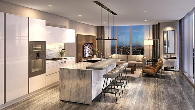 363 E Wacker Dr Unit 5906, Chicago, IL 60601 - kitchen with modern cabinets, high quality fridge, dark wood-type flooring, white cabinetry, and a sink