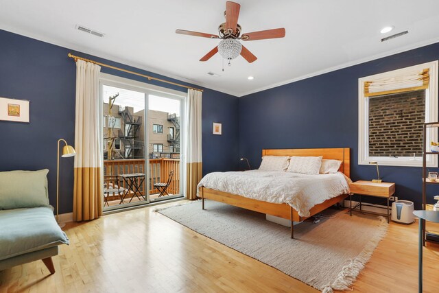 bedroom featuring access to outside, wood finished floors, crown molding, baseboards, and a ceiling fan