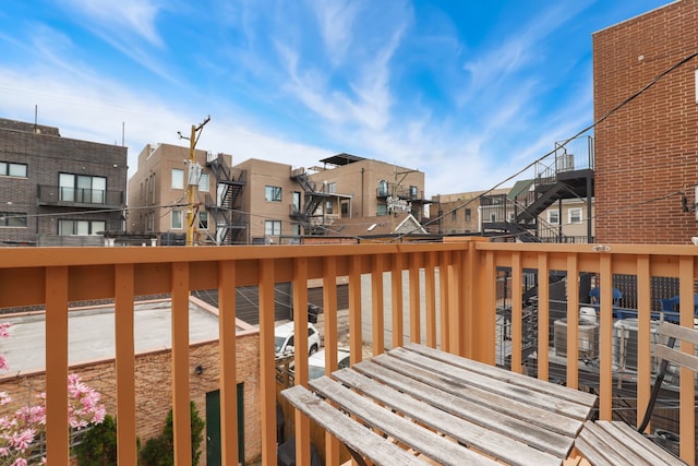 wooden terrace with a residential view