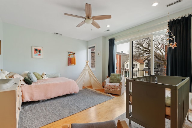 bedroom featuring wood finished floors, recessed lighting, and a ceiling fan