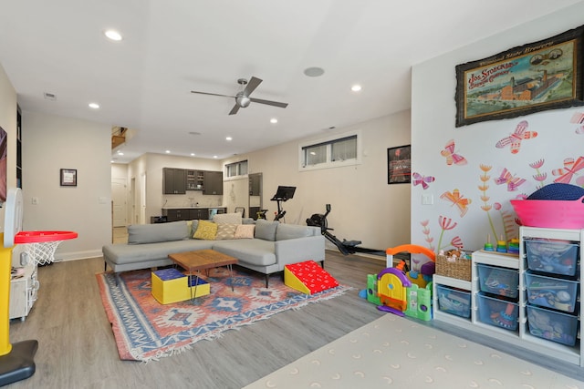 playroom featuring wood finished floors, a ceiling fan, baseboards, and recessed lighting