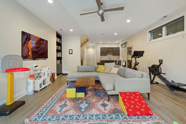 living area featuring wood finished floors, recessed lighting, ceiling fan, and baseboards