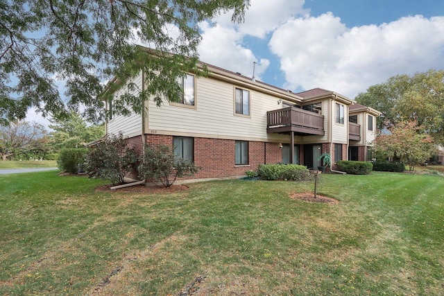 810 E Kings Row Unit 6, Palatine, IL 60074 - rear view of house with a balcony, a yard, and brick siding