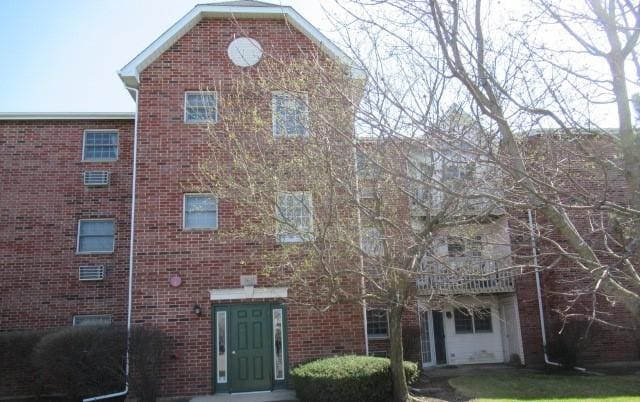 view of front of house with brick siding