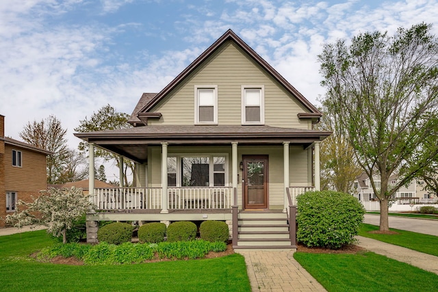 220 N Myrtle Ave, Elmhurst, IL 60126 - farmhouse inspired home with a shingled roof, covered porch, and a front yard