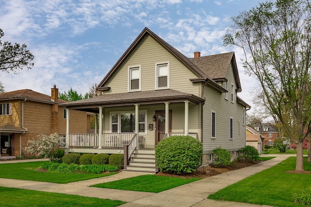220 N Myrtle Ave, Elmhurst, IL 60126 - view of front of property with a chimney, a shingled roof, covered porch, and a front yard