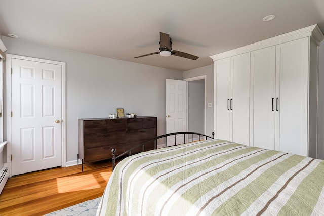 220 N Myrtle Ave, Elmhurst, IL 60126 - bedroom featuring a baseboard radiator, light wood-style flooring, and ceiling fan