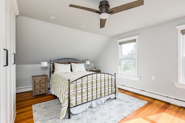 220 N Myrtle Ave, Elmhurst, IL 60126 - bedroom featuring a baseboard radiator, a ceiling fan, wood finished floors, and lofted ceiling