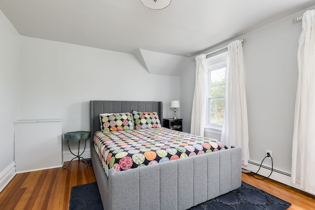 220 N Myrtle Ave, Elmhurst, IL 60126 - bedroom with baseboards, wood finished floors, lofted ceiling, and a baseboard radiator