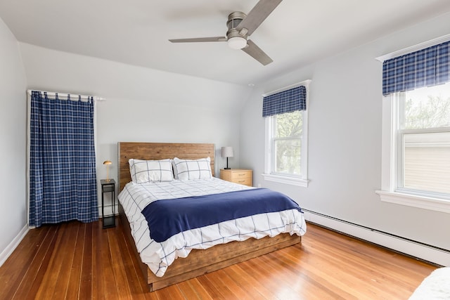220 N Myrtle Ave, Elmhurst, IL 60126 - bedroom with lofted ceiling, baseboards, a baseboard heating unit, hardwood / wood-style flooring, and a ceiling fan