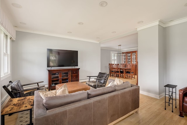 220 N Myrtle Ave, Elmhurst, IL 60126 - living area featuring light wood-style floors, baseboards, crown molding, and a baseboard heating unit