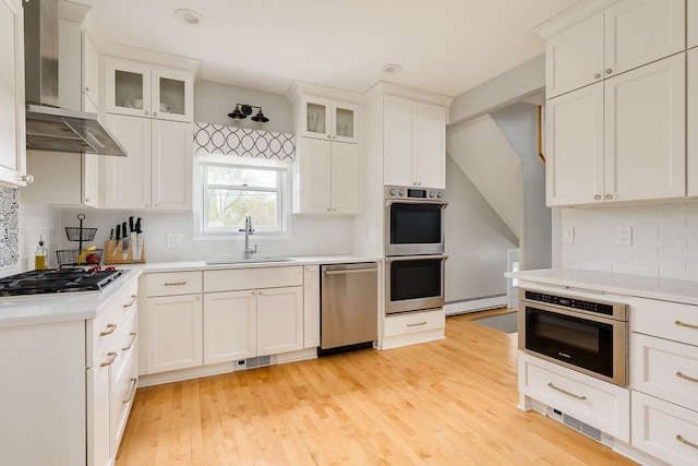 220 N Myrtle Ave, Elmhurst, IL 60126 - kitchen featuring visible vents, wall chimney exhaust hood, a sink, backsplash, and stainless steel appliances