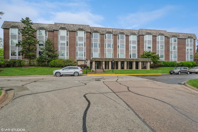 view of property featuring uncovered parking