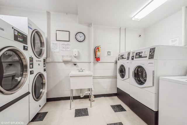 2400 W Archbury Ln Unit 3E, Park Ridge, IL 60068 - shared laundry area with separate washer and dryer, stacked washer / drying machine, and concrete block wall