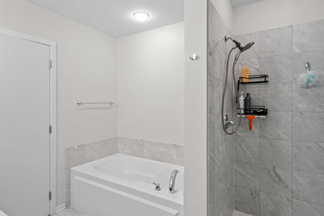 full bathroom featuring a bath and a stall shower
