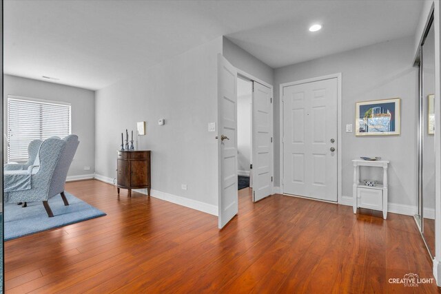 foyer entrance featuring recessed lighting, baseboards, and wood finished floors